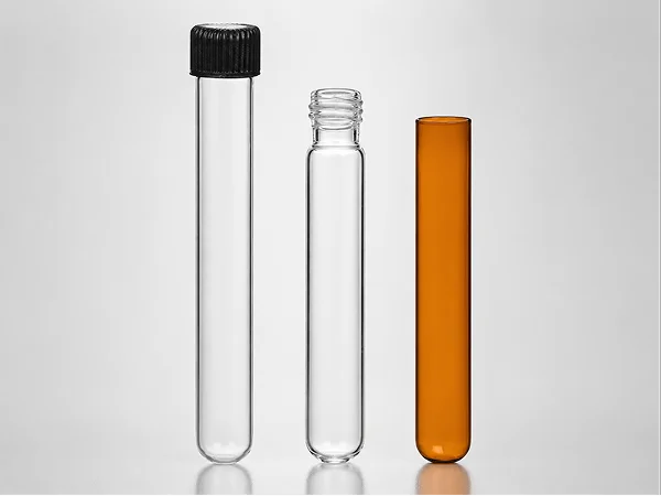 Three round-bottom glass test tubes: capped, threaded, and straight-mouth amber.