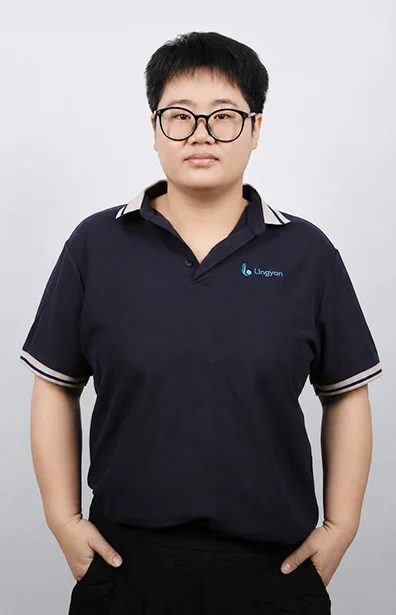 FENG is standing with her hands in her pockets.