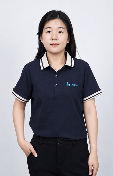 Yara wears a navy uniform and stands with one hand naturally in her pocket.