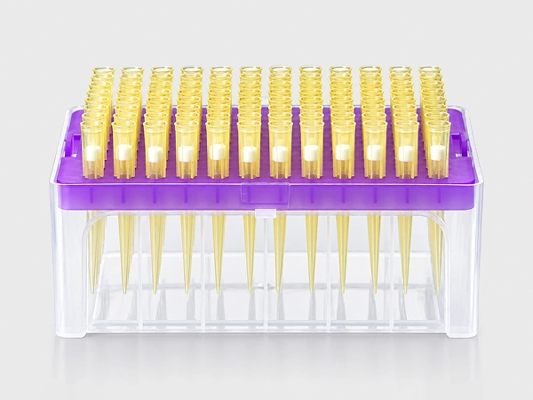 Rows of yellow pipette tips arranged in a purple rack.