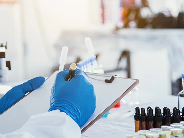 Laboratory staff record and inspect samples.