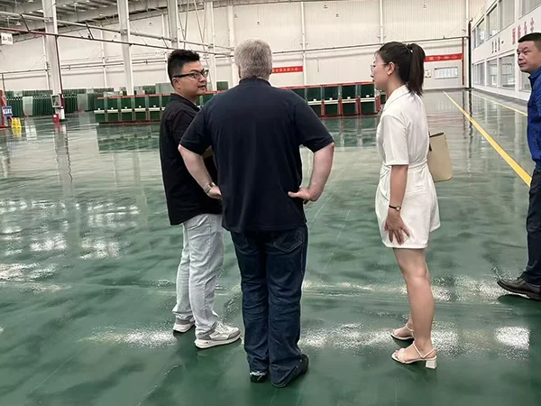 Our representative visits the production area with the customer and factory manager.