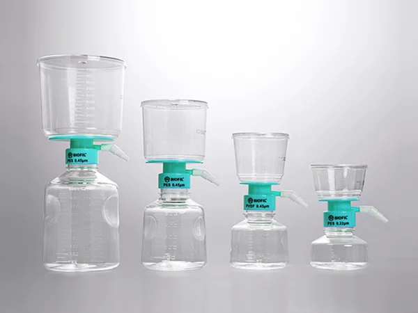 Four vacuum filtration systems with funnels and receiver bottles in different sizes.