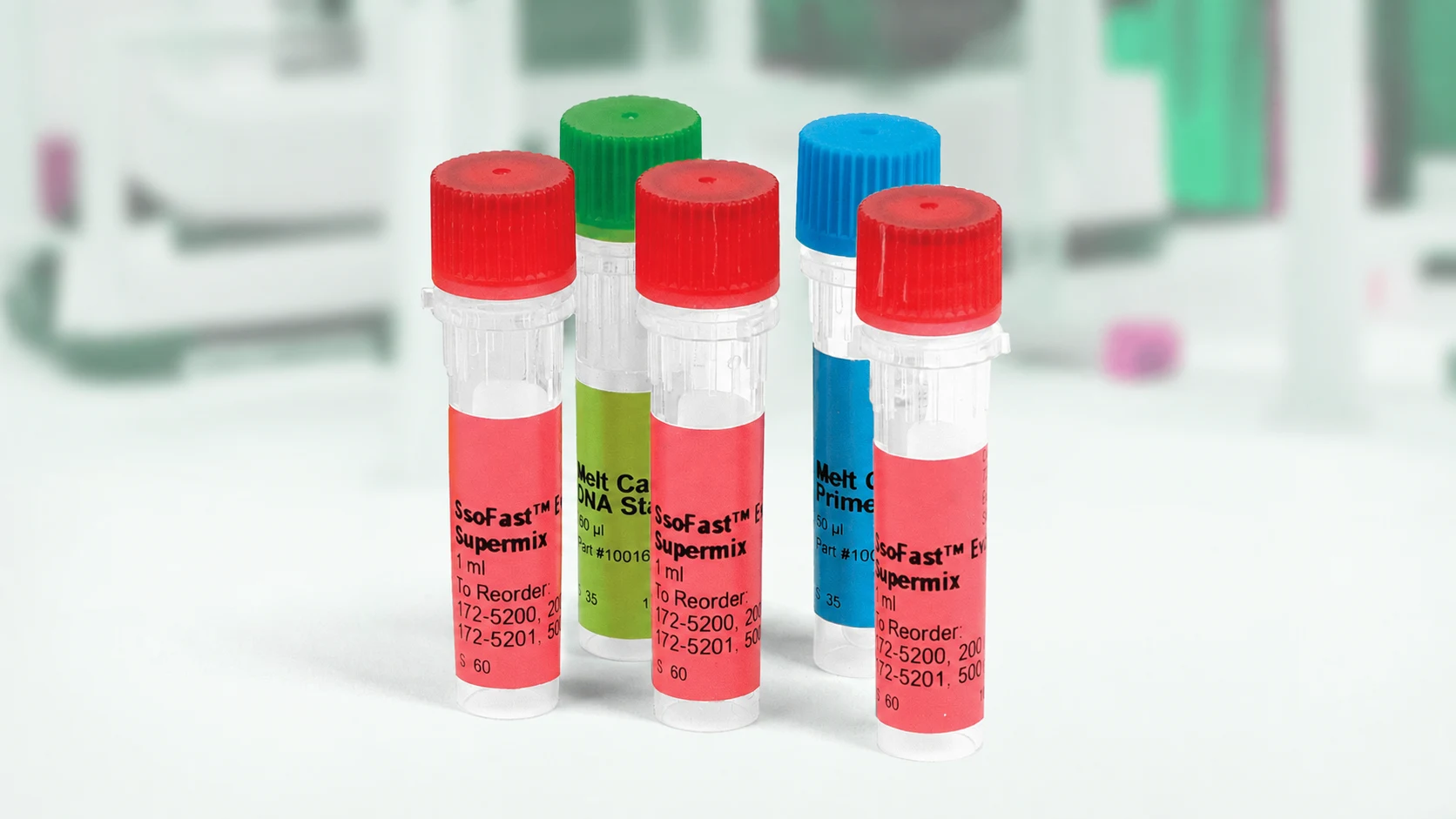 Laboratory reagent tubes with colored caps arranged.